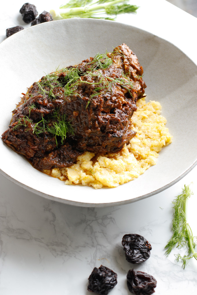 Mediterranean Short Ribs with Polenta - This recipe is super impressive yet really easy to make. It has a surprising secret ingredient that makes all the difference. | circleofeaters.com